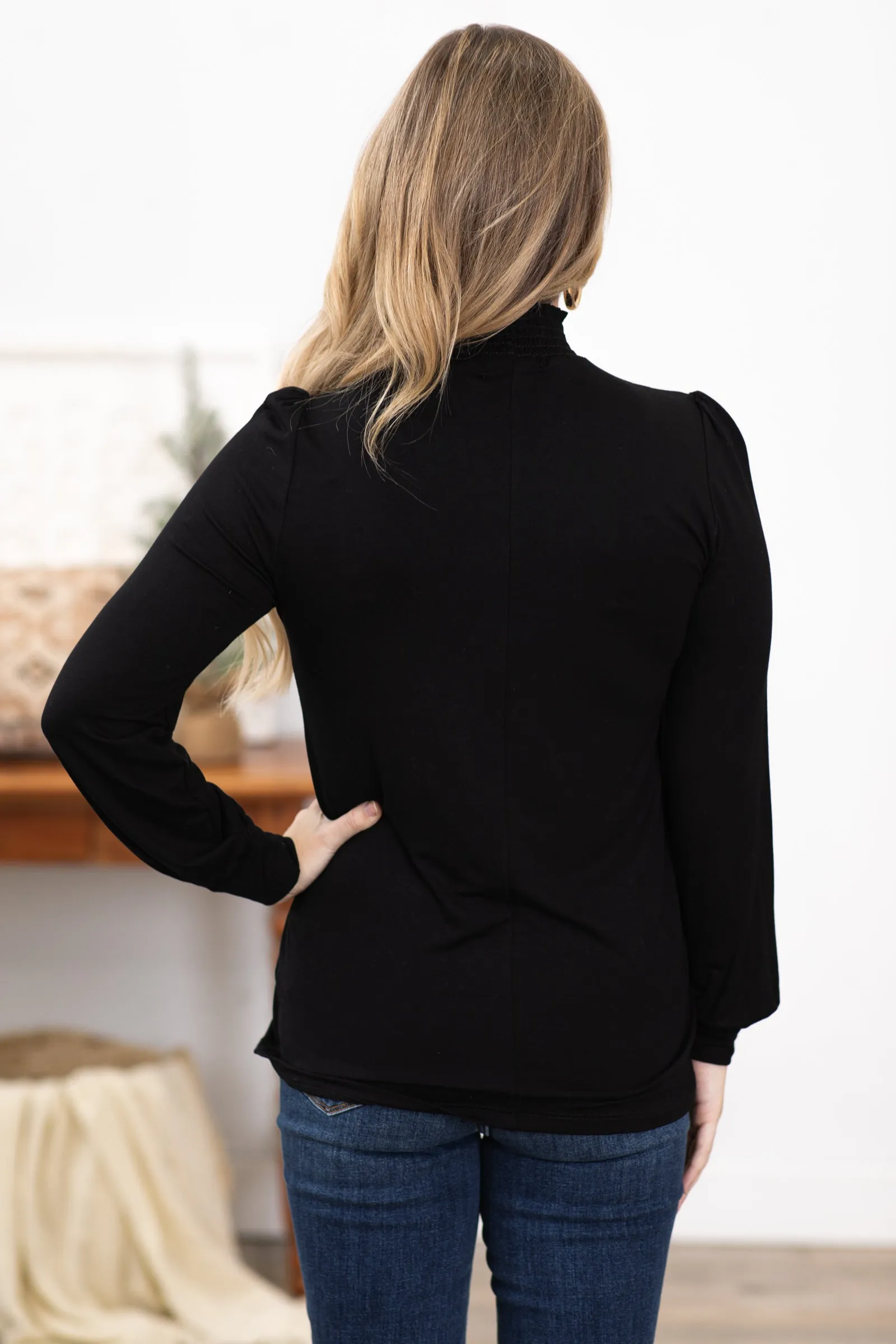 Black Smocked Turtleneck Top